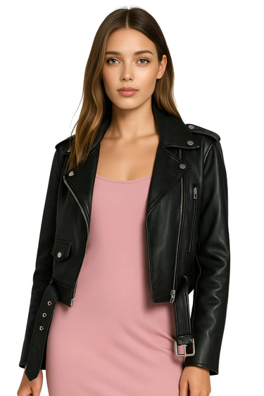 Woman wearing a black leather jacket over a pink slip dress on a white background